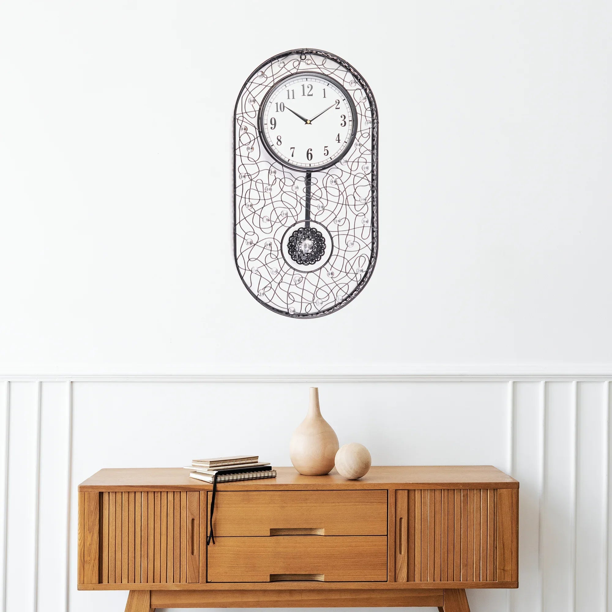Rhythm Metal And Glass Oval Pendulum Wall Clock in Black Colour - HomeTown