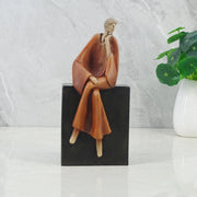 Alpine Polyresin Man Posing On Bench 23 Cm in Brown Colour - HomeTown