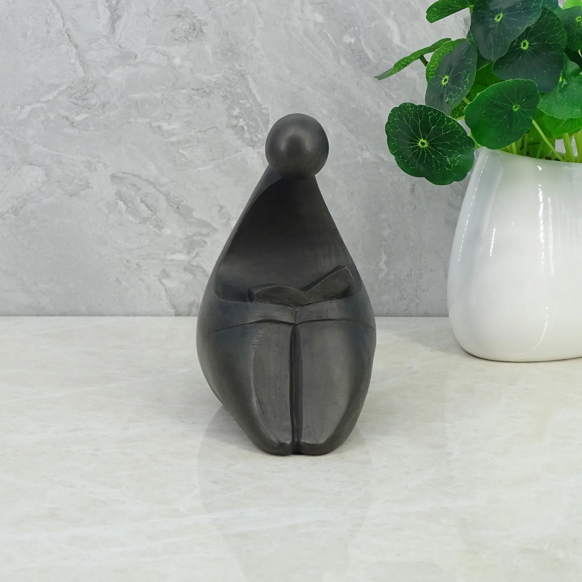 Noire Polyresin Man Reading Book 15 Cm in Black Colour - HomeTown