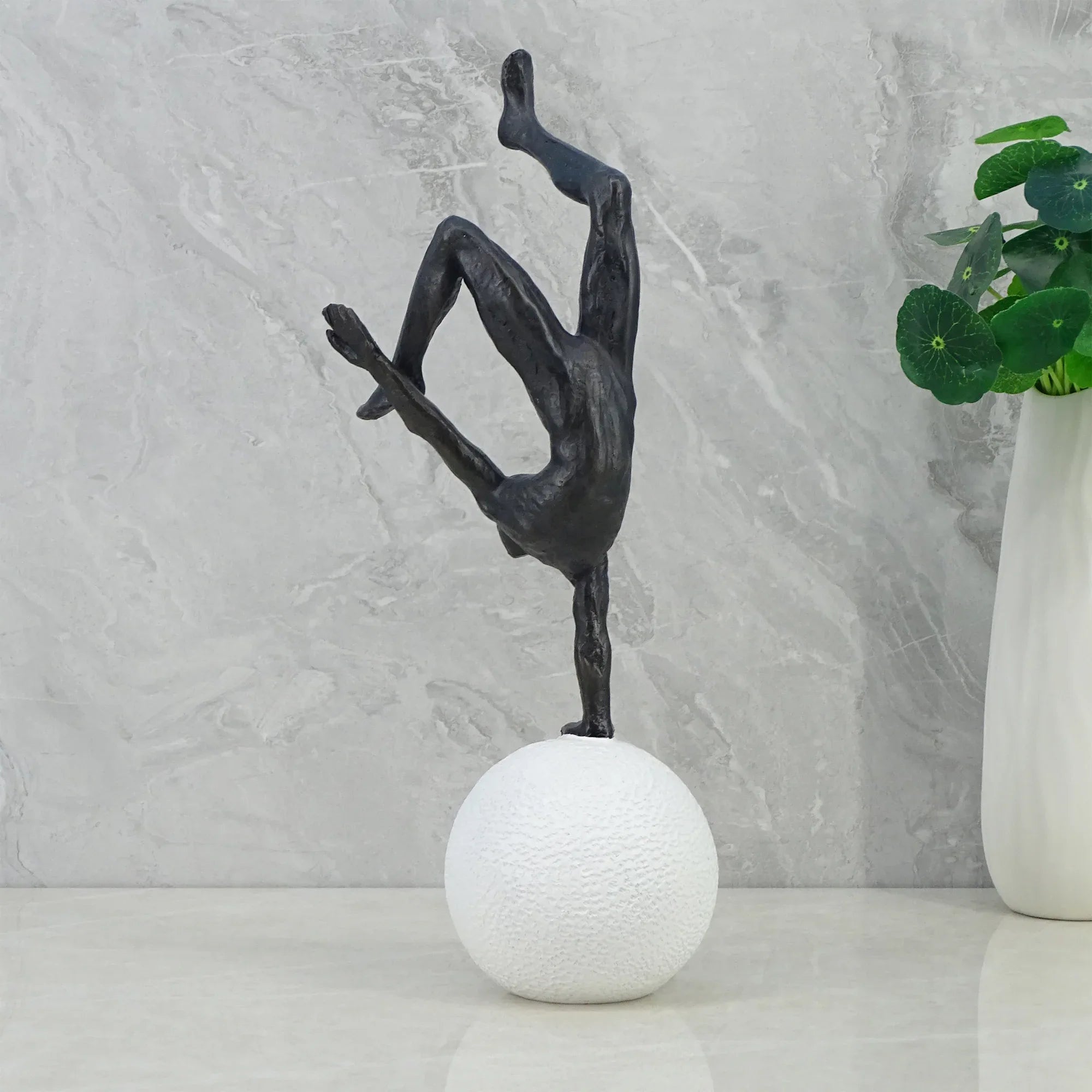 Willow Polyresin Man Balancing On Ball 30Cm in Black And White Colour - HomeTown