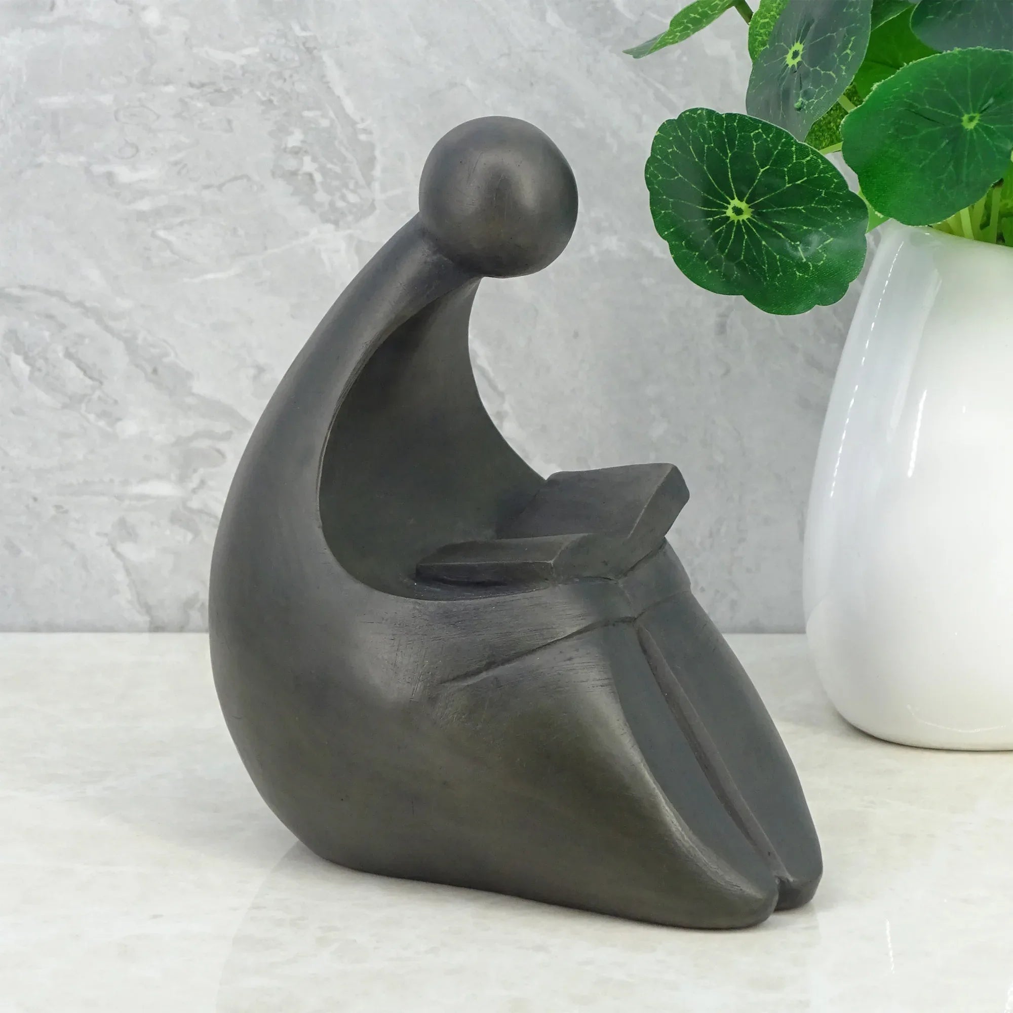 Noire Polyresin Man Reading Book 15 Cm in Black Colour - HomeTown